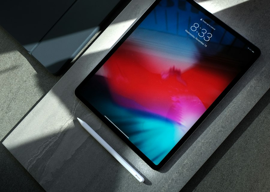 A tablet with a stylus on a stone desk